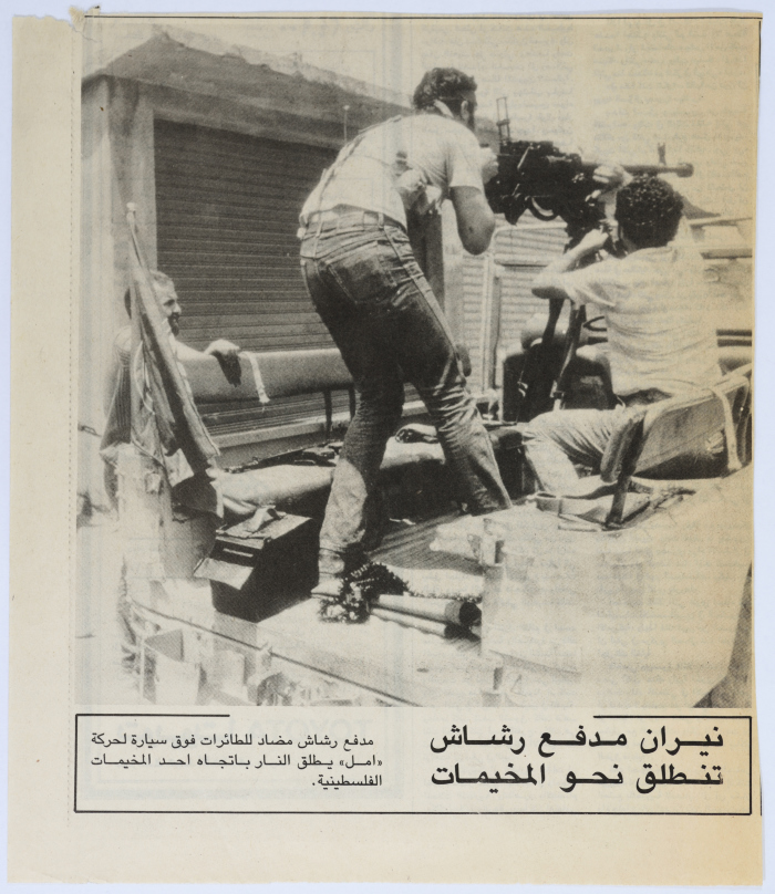 Armed Men Atop an Amal Vehicle, Aiming at a Camp 