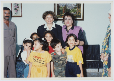 Entesar al-Wazir with a Supervisor and a Group of Children at the Childhood Protection Center