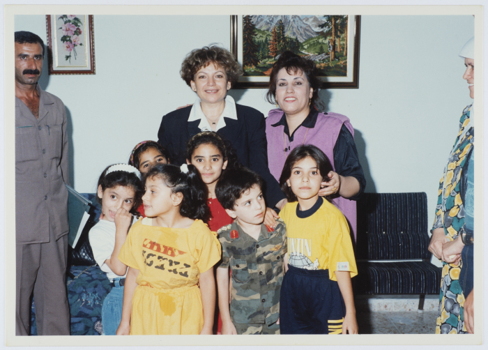 Entesar al-Wazir with a Supervisor and a Group of Children at the Childhood Protection Center