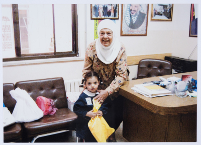 Handing certificates at the graduation ceremony of the kindergarten of Qalandiya Camp Women Handicraft Cooperative Society