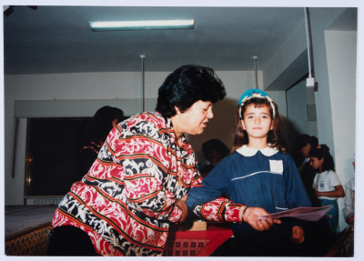 Handing certificates at the graduation ceremony of the kindergarten of Qalandiya Camp Women Handicraft Cooperative Society