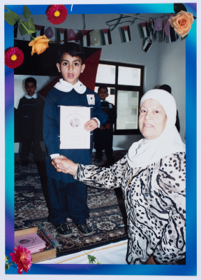 Handing certificates at the graduation ceremony of the kindergarten of Qalandiya Camp Women Handicraft Cooperative Society
