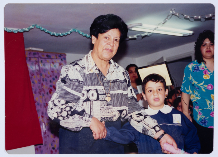 Handing certificates at the graduation ceremony of the kindergarten of Qalandiya Camp Women Handicraft Cooperative Society