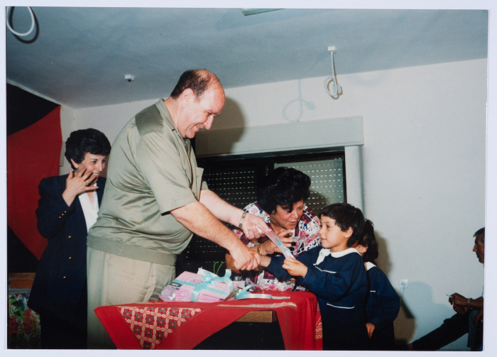 Handing certificates at the graduation ceremony of the kindergarten of Qalandiya Camp Women Handicraft Cooperative Society