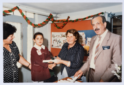 Handing certificates at the graduation ceremony of the kindergarten of Qalandiya Camp Women Handicraft Cooperative Society