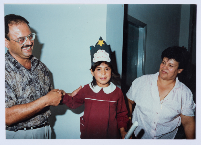 Handing certificates at the graduation ceremony of the kindergarten of Qalandiya Camp Women Handicraft Cooperative Society
