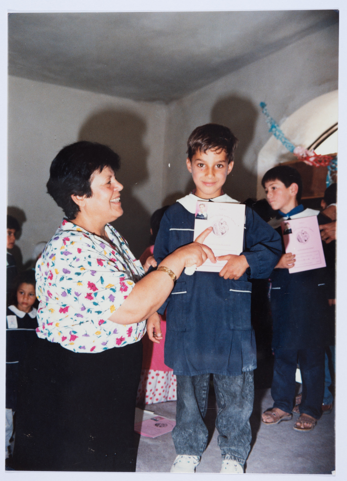 Handing certificates at the graduation ceremony of the kindergarten of Qalandiya Camp Women Handicraft Cooperative Society