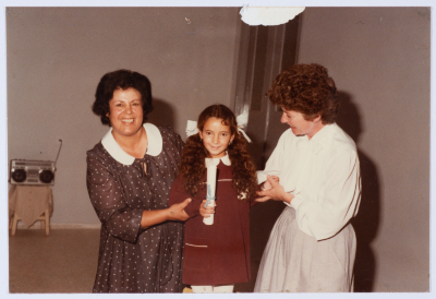 Handing certificates at the graduation ceremony of the kindergarten of Qalandiya Camp Women Handicraft Cooperative Society