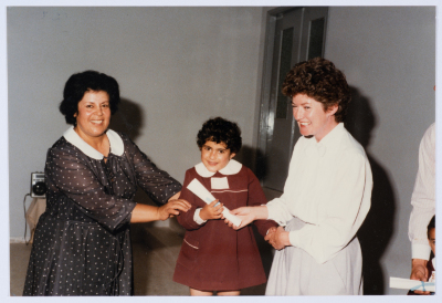 Handing certificates at the graduation ceremony of the kindergarten of Qalandiya Camp Women Handicraft Cooperative Society