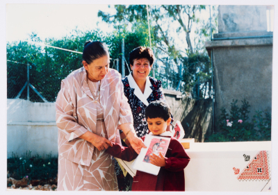 Handing certificates at the graduation ceremony of the kindergarten of Qalandiya Camp Women Handicraft Cooperative Society