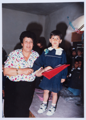 Handing certificates at the graduation ceremony of the kindergarten of Qalandiya Camp Women Handicraft Cooperative Society