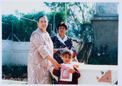 Handing certificates at the graduation ceremony of the kindergarten of Qalandiya Camp Women Handicraft Cooperative Society