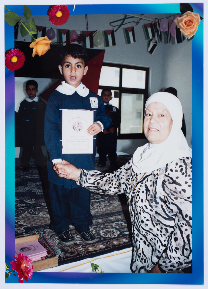 Handing certificates at the graduation ceremony of the kindergarten of Qalandiya Camp Women Handicraft Cooperative Society