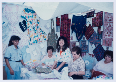 Qalandiya Camp Women Handicraft Cooperative Society participating in a local exhibition of Palestinian embroidery and heritage
