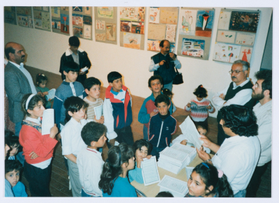 Children of Qalandiya Camp Women Handicraft Cooperative Society participating in an exhibition of visual arts in 1990