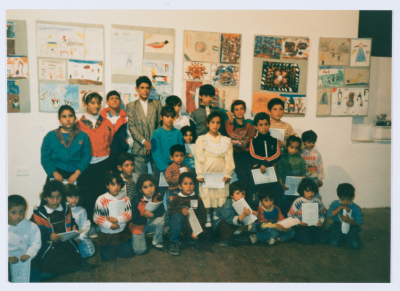 Children of Qalandiya Camp Women Handicraft Cooperative Society participating in an exhibition of visual arts in 1990
