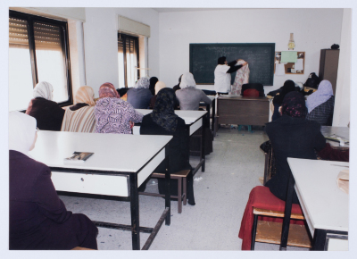 Female workers in Qalandiya Camp Women Handicraft Cooperative Society sewing factory