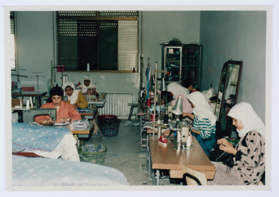 Female workers in Qalandiya Camp Women Handicraft Cooperative Society sewing factory