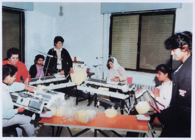 Female workers in Qalandiya Camp Women Handicraft Cooperative Society sewing factory