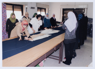 Female workers in Qalandiya Camp Women Handicraft Cooperative Society sewing factory
