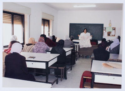 Female workers in Qalandiya Camp Women Handicraft Cooperative Society sewing factory