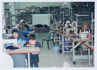 Female workers in Qalandiya Camp Women Handicraft Cooperative Society sewing factory