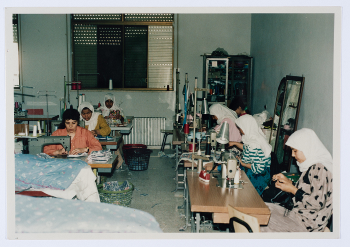 Female workers in Qalandiya Camp Women Handicraft Cooperative Society sewing factory