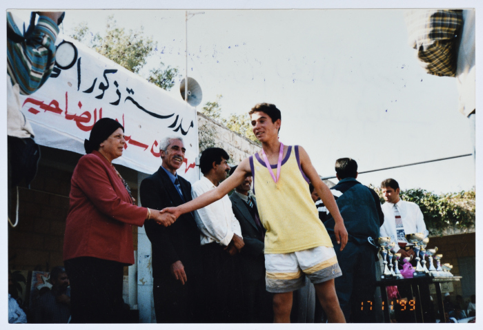Mrs Muntaha al-Budairi Honours the Winners of the Cross-Country Race in Ramallah