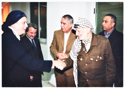 Mrs Muntaha Jarrár Shaking Hands with the Late Abu ʿammar When he was Minister of Education