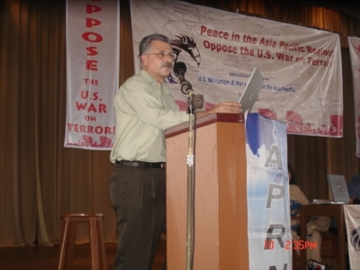Ahmad al-Maslamany speaking at a conference