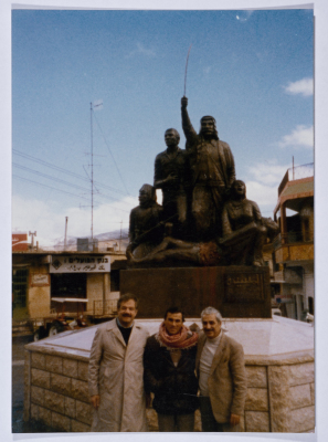 Tawfiq Ziad in front of the statue of the march in the town of Majdal Shams